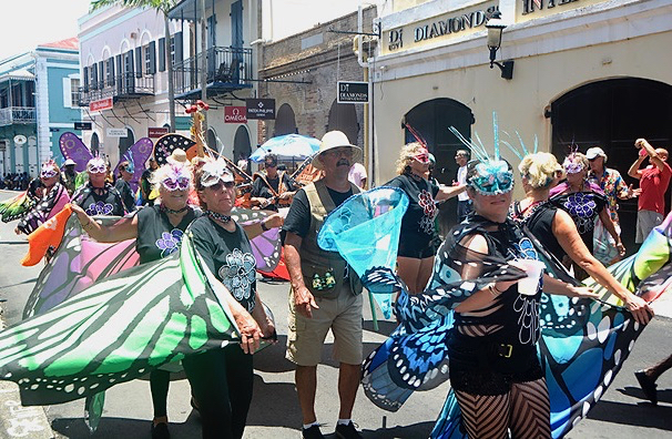 "Butterflies" journey through the streets, greeting the Carnival crowd.