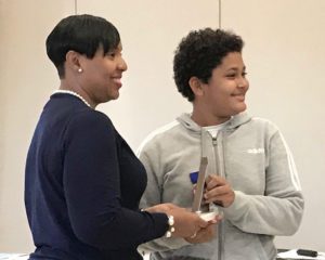 Deputy Superintendent Carla Bastian congratulates First Place Samir Boucenna. (Source Photo by Elisa McKay)