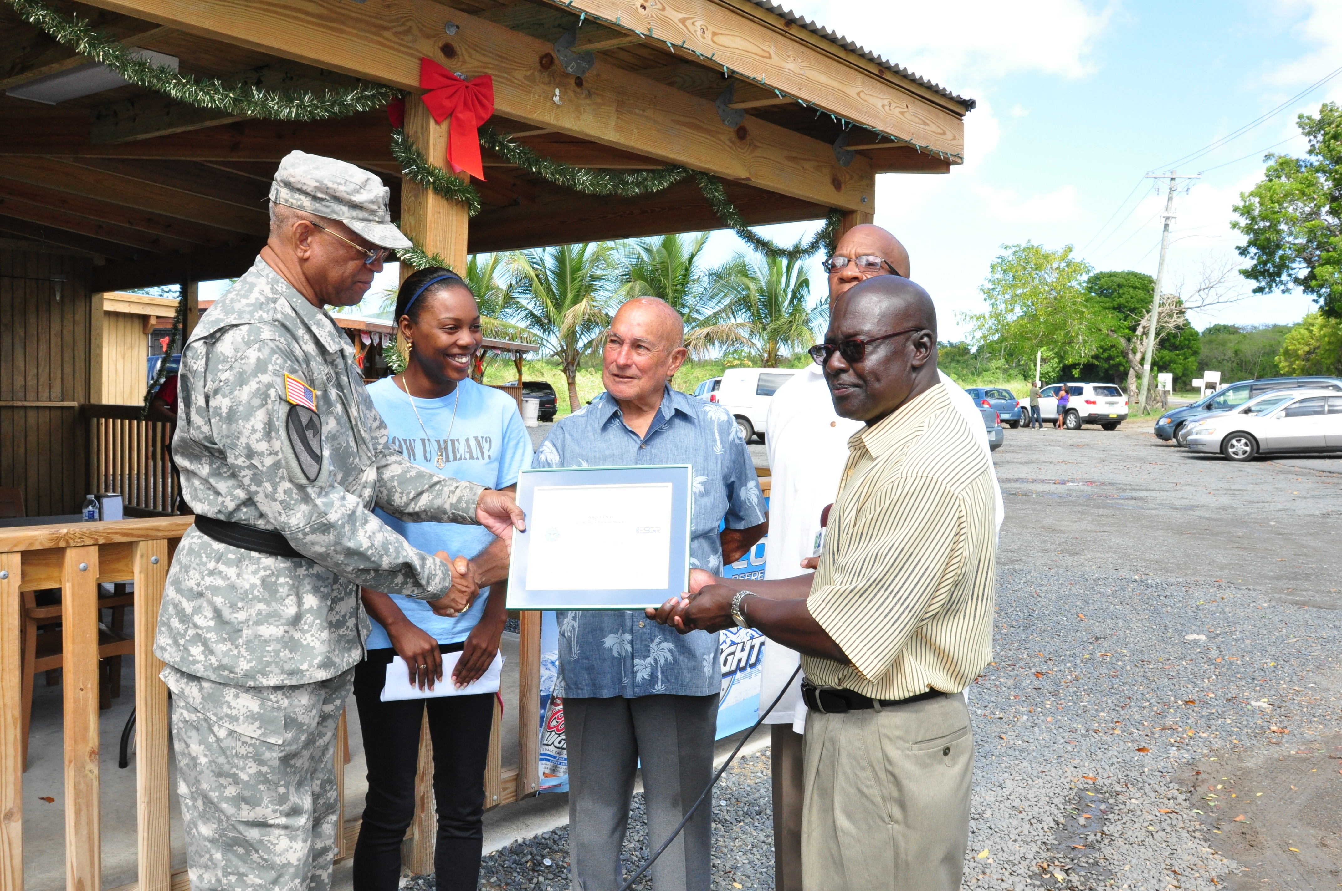 La Reine Chicken Shack Owner Honored by Department of Defense